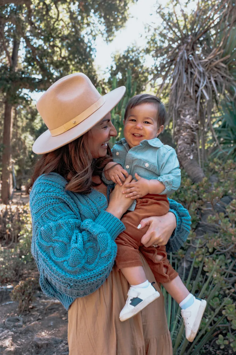 A mom and her baby laughing