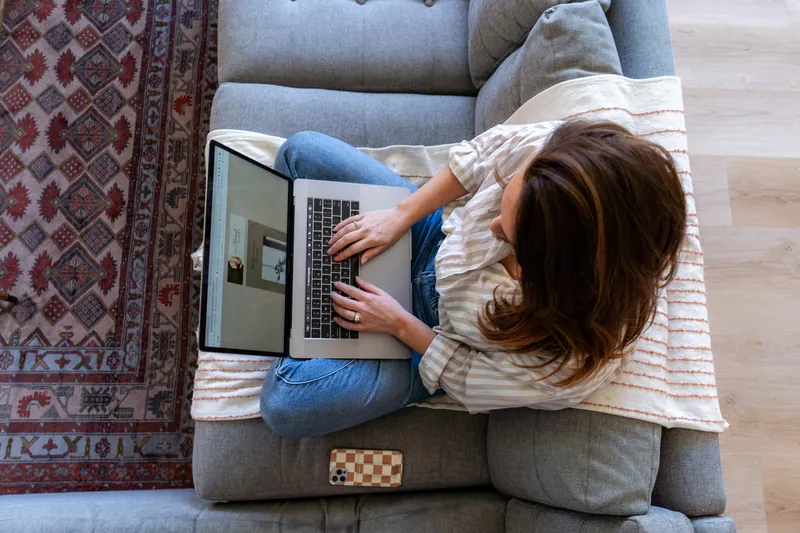 Working on a laptop on the couch, from above